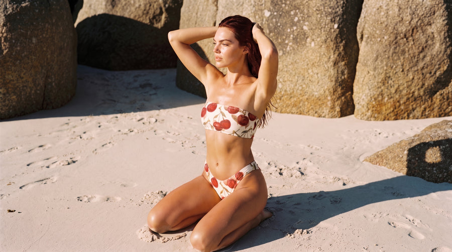 Dolce Cherry bandeau bikini set on golden sand