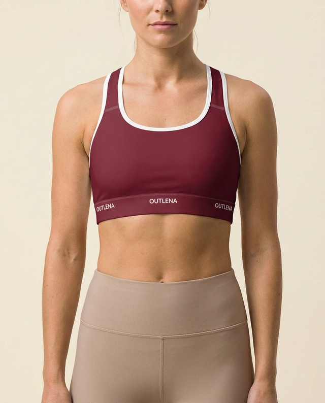 Model wearing OUTLENA Elevate Contrast Sports Bra Cherry Burgundy