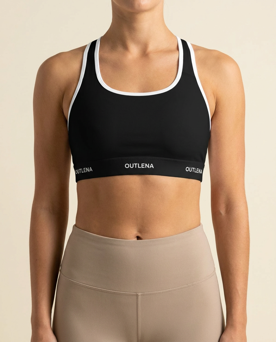 Model wearing OUTLENA Elevate Contrast Sports Bra Onyx Black
