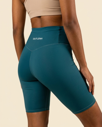 OUTLENA Sculpt Biker Shorts Deep Teal, back with OUTLENA logo