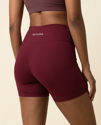 OUTLENA Sculpt Biker Shorts Cherry Burgundy, back with OUTLENA logo