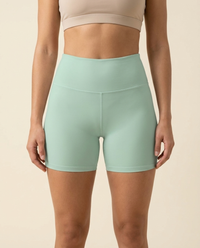 OUTLENA Sculpt Yoga Shorts Soft Mint, front on model